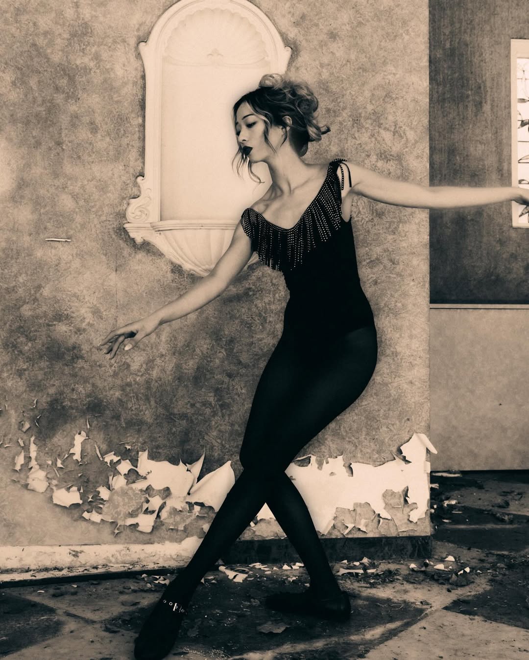 Bambi Shepherd mid-movement in a derelict room